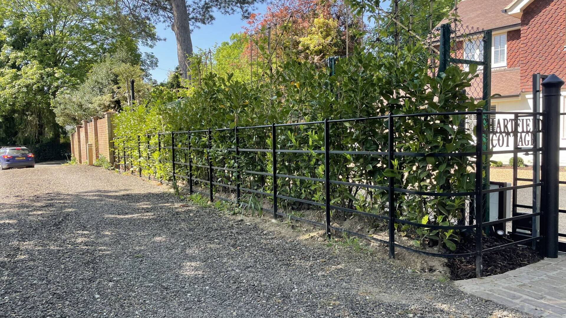 Custom fencing and metal fabrication to accompany bespoke electric sliding gate
