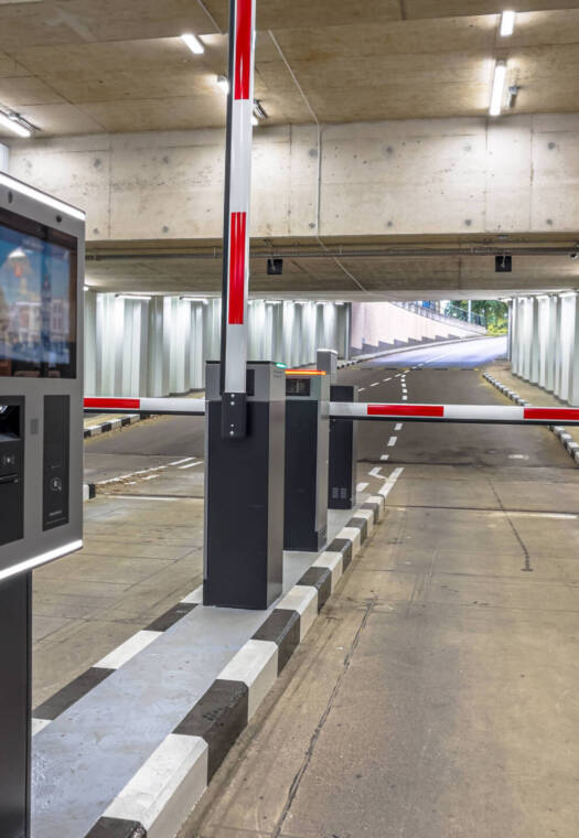 Barrier at Entrance and Exit of a car Parking garage. Fully automated barrier from car park. Underground parking, garage. Interior of parking